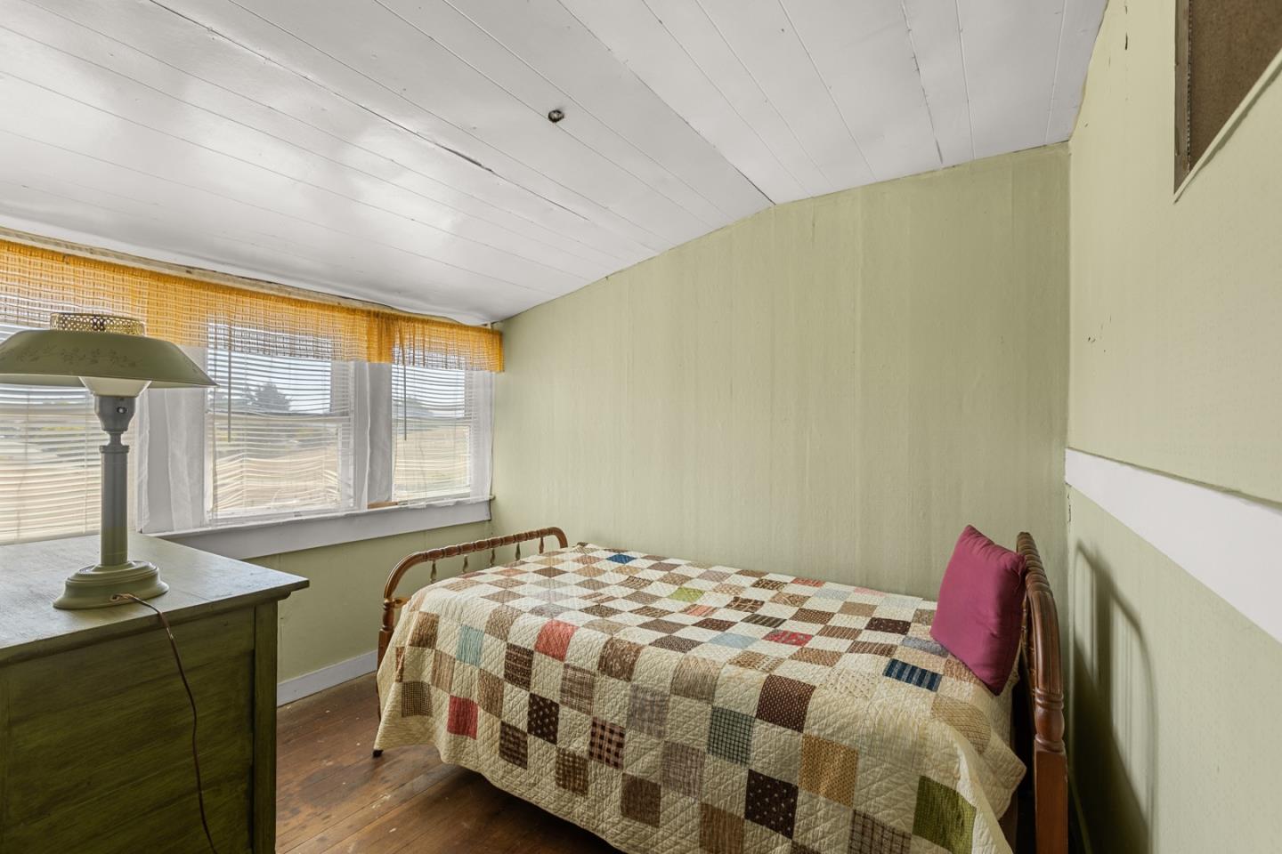 14550 Valley Ford Estero Road Valley Ford, CA 94972 - Photo 36 of 41 a bedroom with a bed and a window