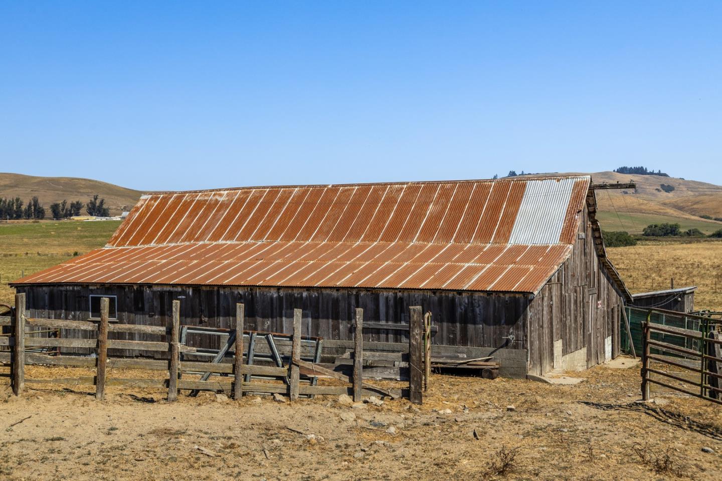 14550 Valley Ford Estero Road Valley Ford, CA 94972 - Photo 9 of 41 a view of deck with table and chairs