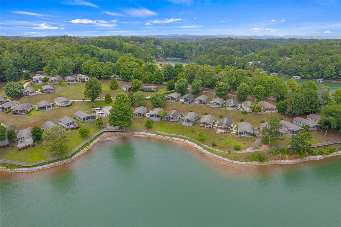 1230 Melton Road, Unit 25 West Union, SC 29696 - Photo 44 of 46 Aerial view captures a serene lakeside community with abundant natural beauty.