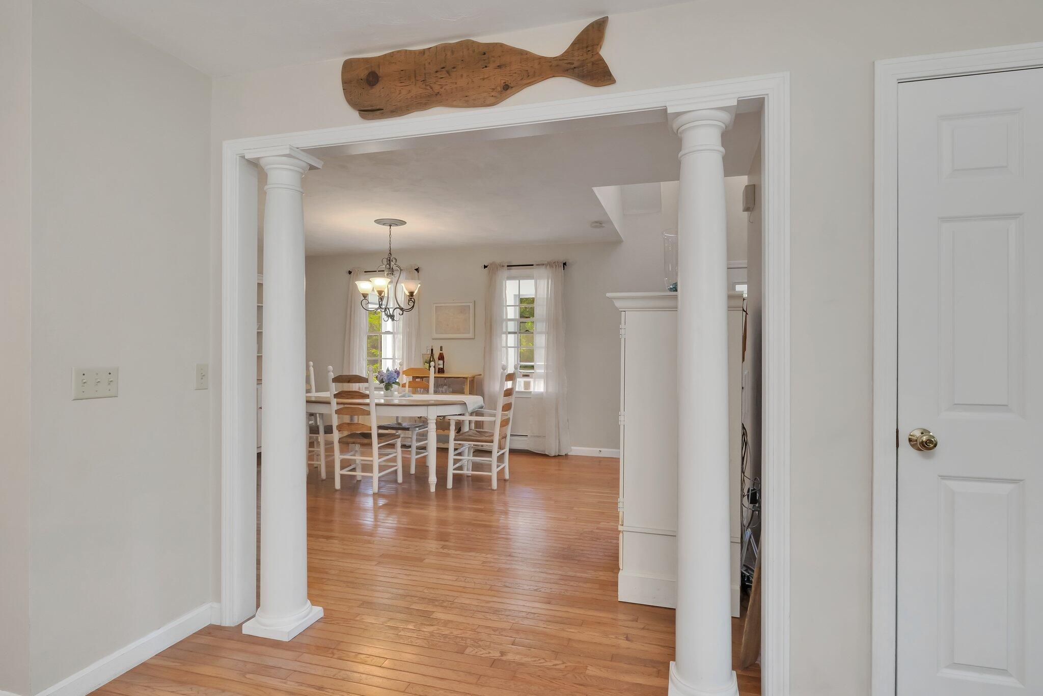 45 Briar Lane West Barnstable, MA 02668 - Photo 11 of 44 a view of a dining room with wooden floor a glass table and chairs