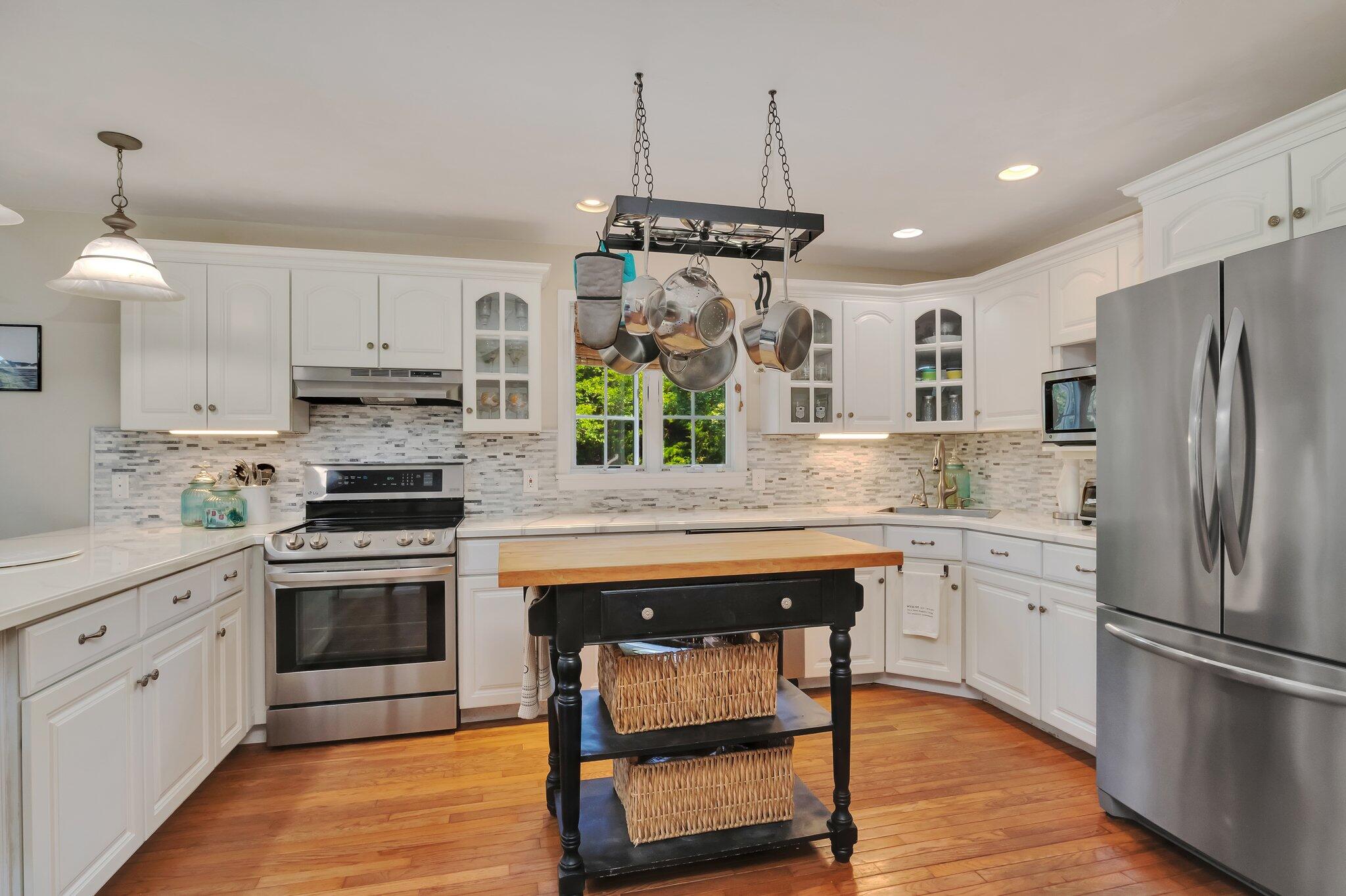 45 Briar Lane West Barnstable, MA 02668 - Photo 12 of 44 a kitchen with stainless steel appliances granite countertop a stove a sink and a refrigerator