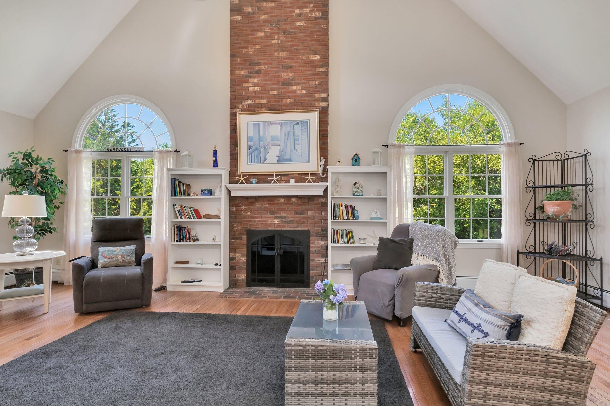 45 Briar Lane West Barnstable, MA 02668 - Photo 15 of 44 a living room with furniture a fireplace and a large window
