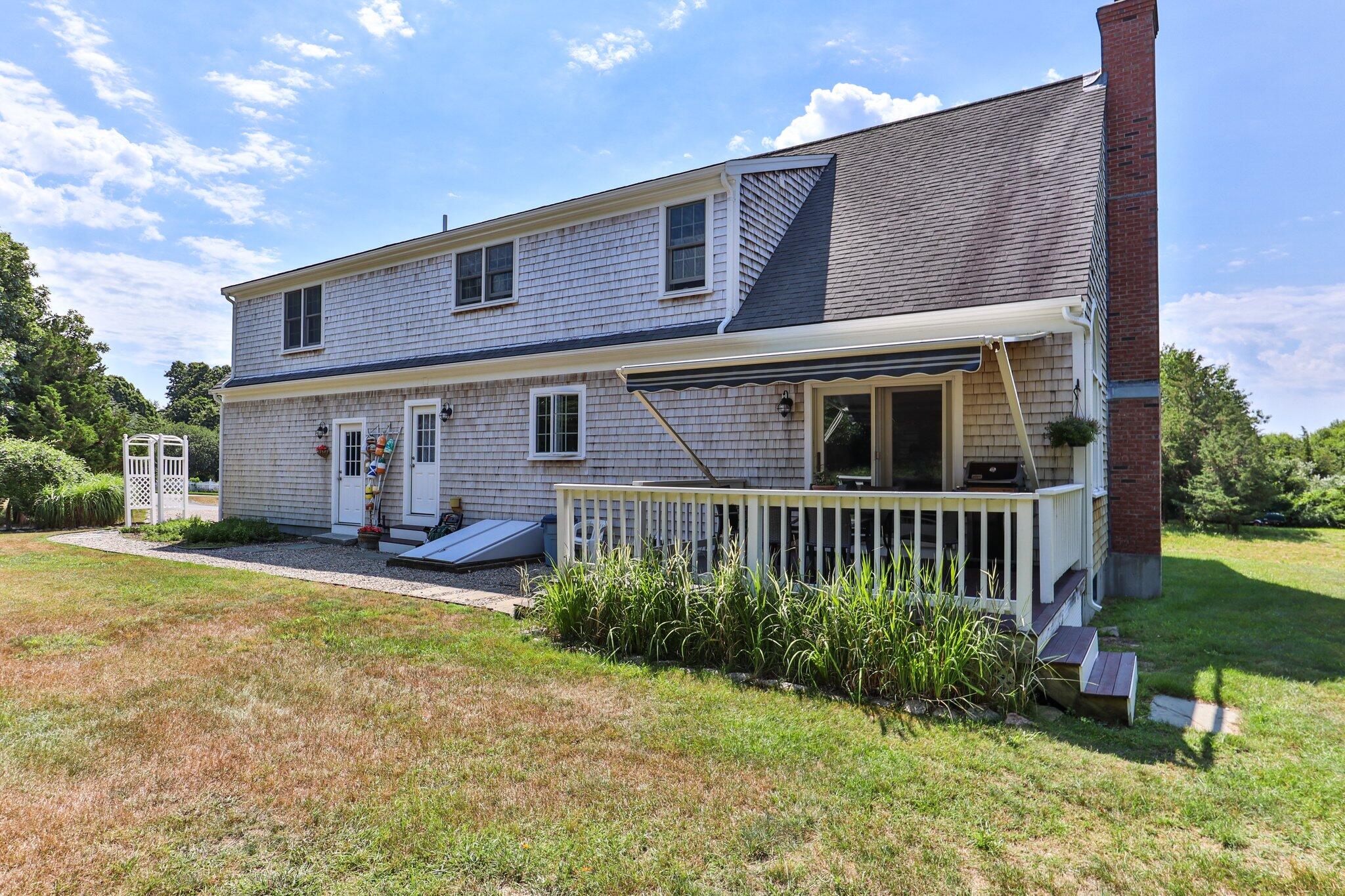 45 Briar Lane West Barnstable, MA 02668 - Photo 30 of 44 a view of a house with backyard and sitting area