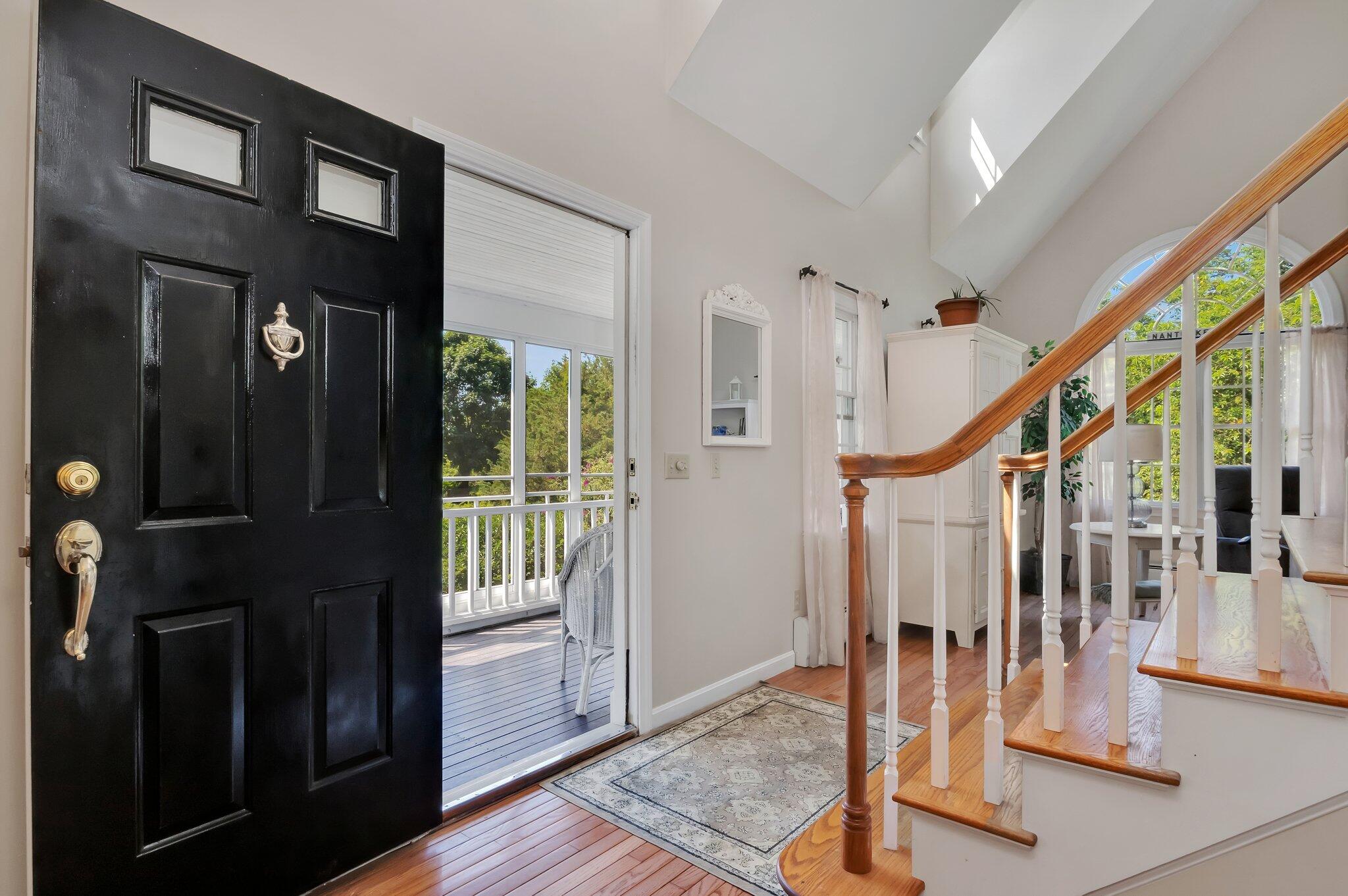 45 Briar Lane West Barnstable, MA 02668 - Photo 8 of 44 a view of staircase with lots of frames on wall and wooden floor