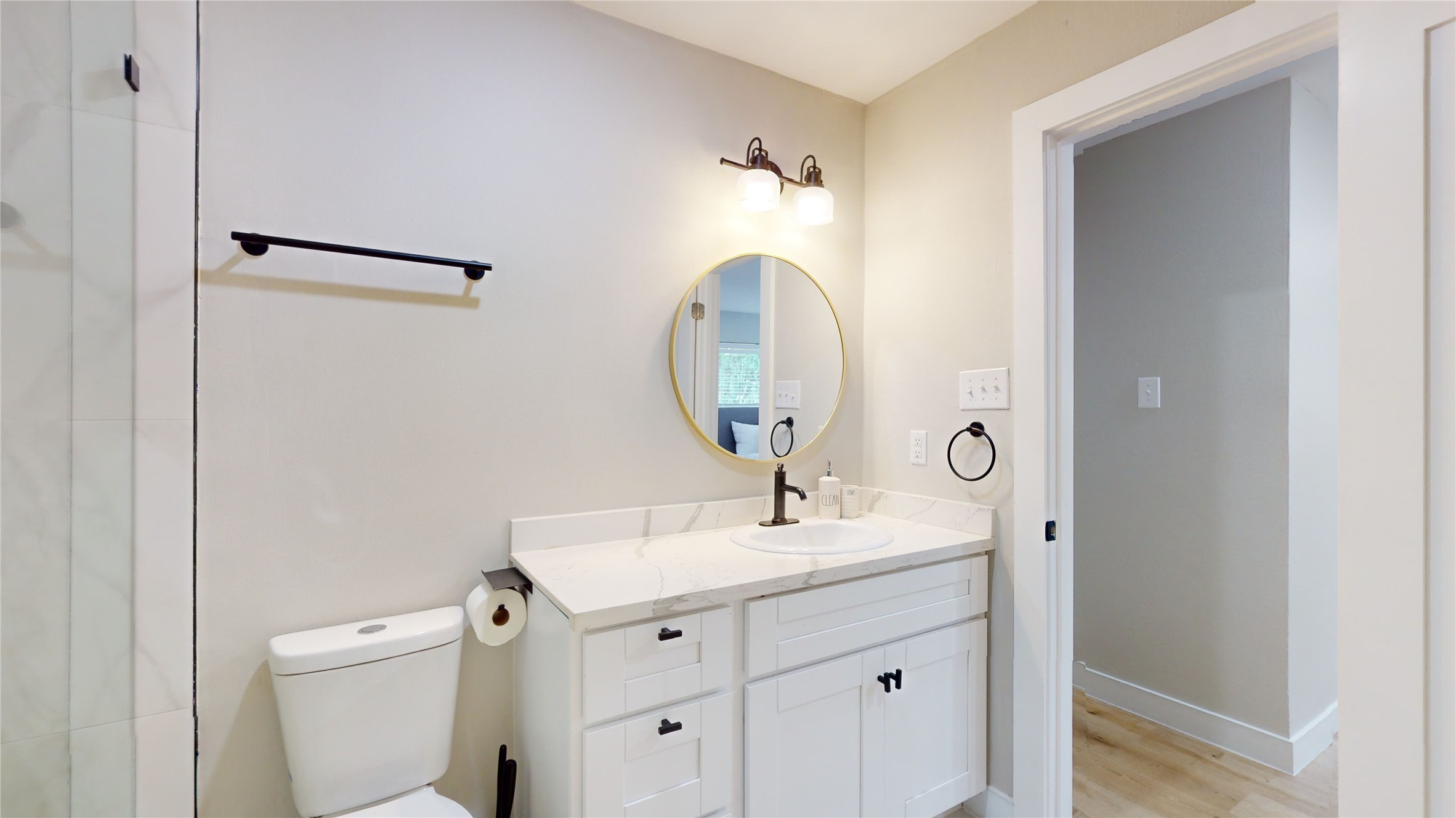 5455 Birdwood Road Houston, TX 77096 - Photo 11 of 26 a bathroom with a sink toilet and a mirror