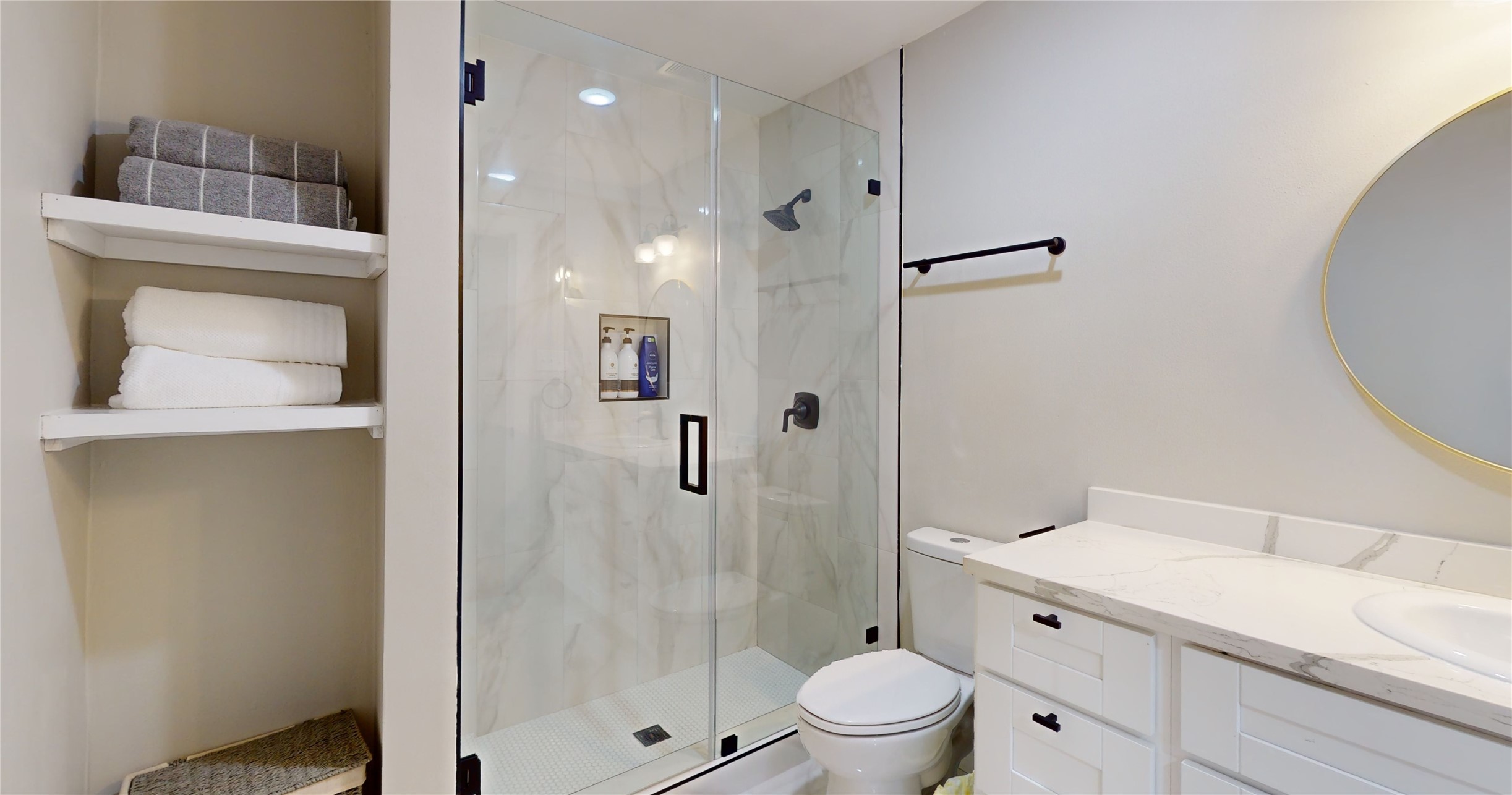 5455 Birdwood Road Houston, TX 77096 - Photo 12 of 26 a bathroom with a shower sink vanity mirror and toilet