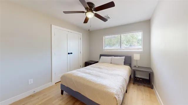 a bedroom with a bed and window