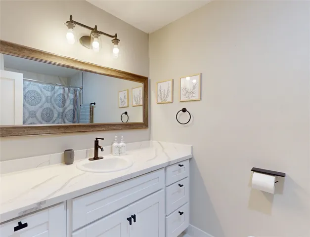 a bathroom with a bathtub and shower