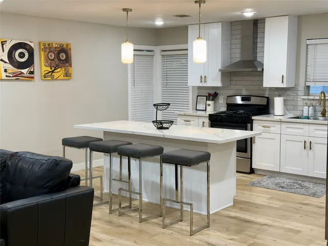 a kitchen with a sink cabinets and window
