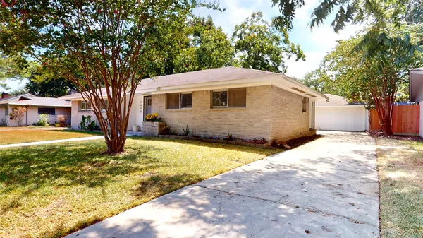 a view of a house with backyard porch and sitting area