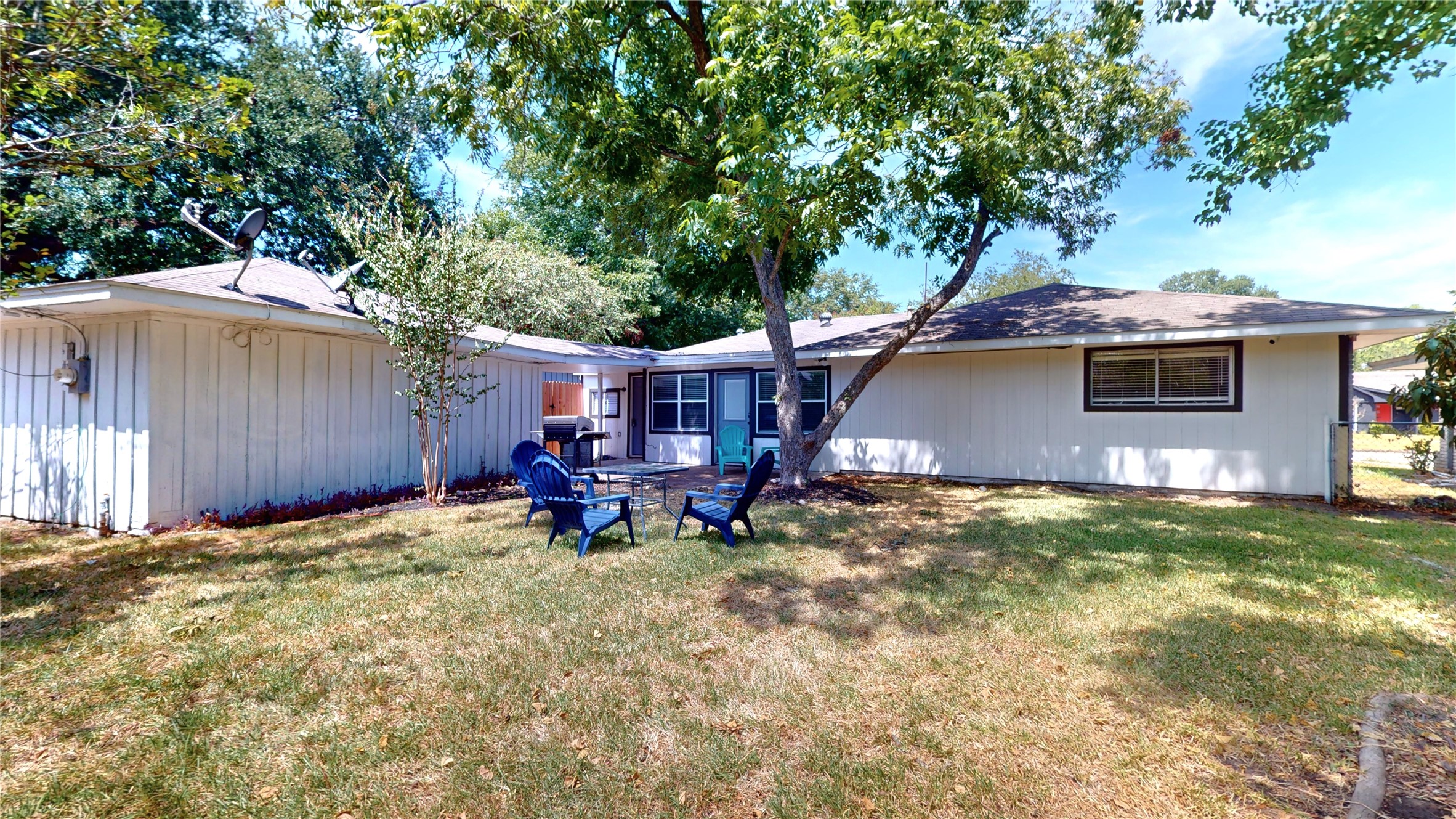 5455 Birdwood Road Houston, TX 77096 - Photo 24 of 26 a view of a house with backyard porch and sitting area