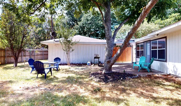 a kitchen with stainless steel appliances kitchen island granite countertop a sink a refrigerator and a microwave