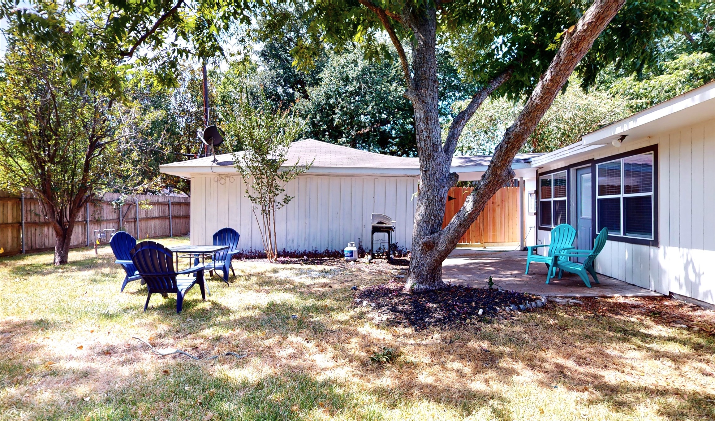 5455 Birdwood Road Houston, TX 77096 - Photo 25 of 26 a view of a house with backyard and sitting area