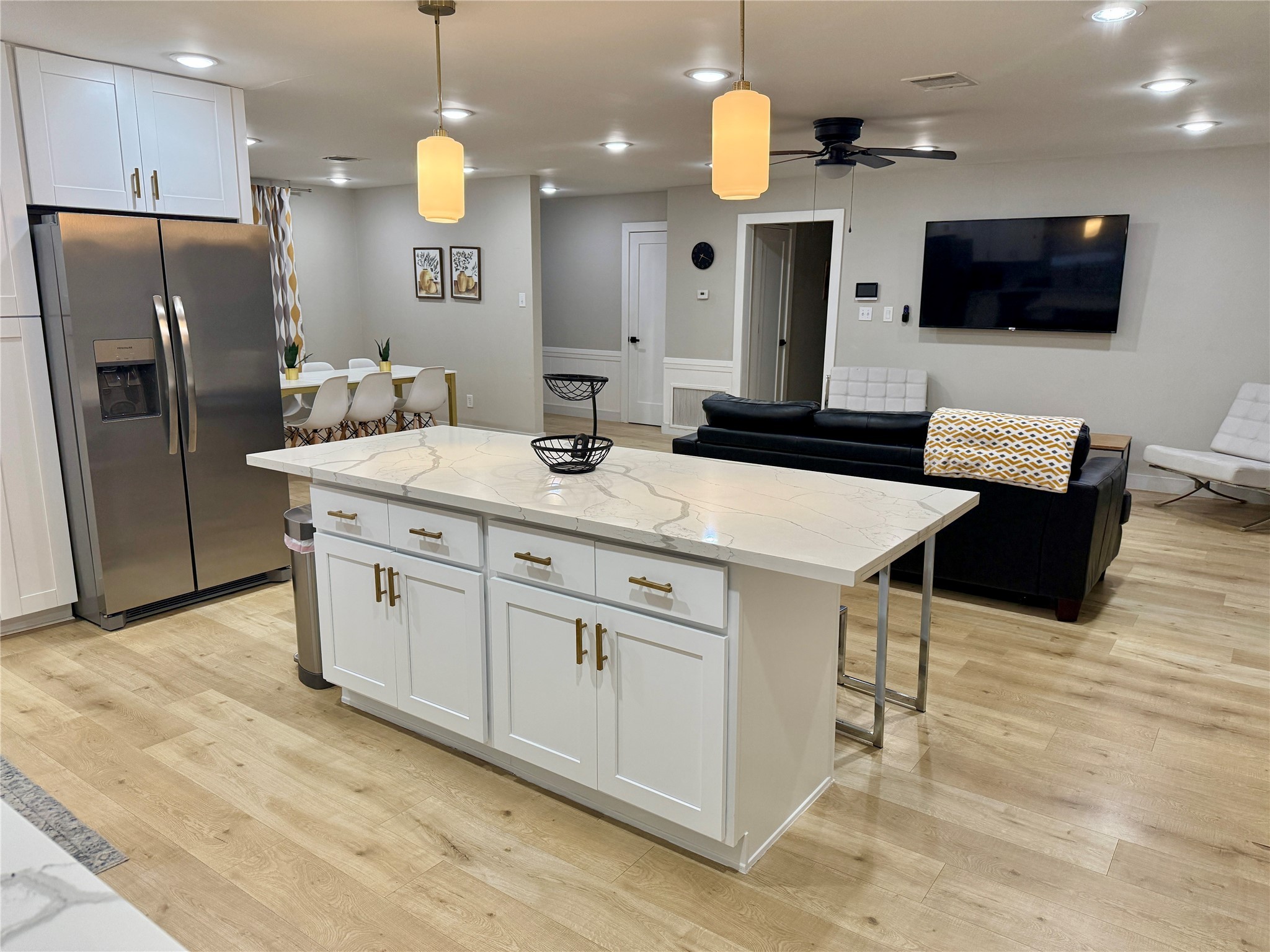 5455 Birdwood Road Houston, TX 77096 - Photo 26 of 26 a kitchen with stainless steel appliances kitchen island granite countertop a sink a refrigerator and a microwave