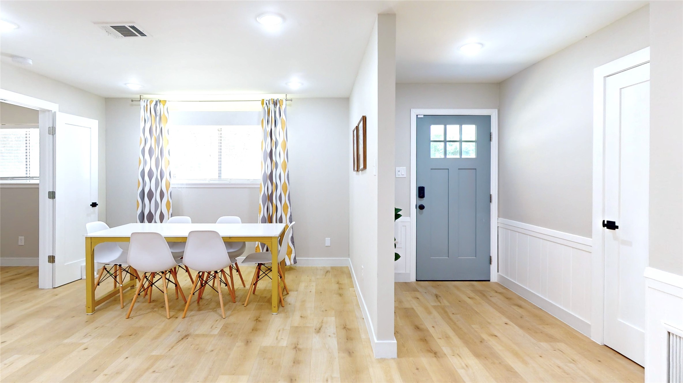 5455 Birdwood Road Houston, TX 77096 - Photo 7 of 26 a view of a dining room with furniture and wooden floor