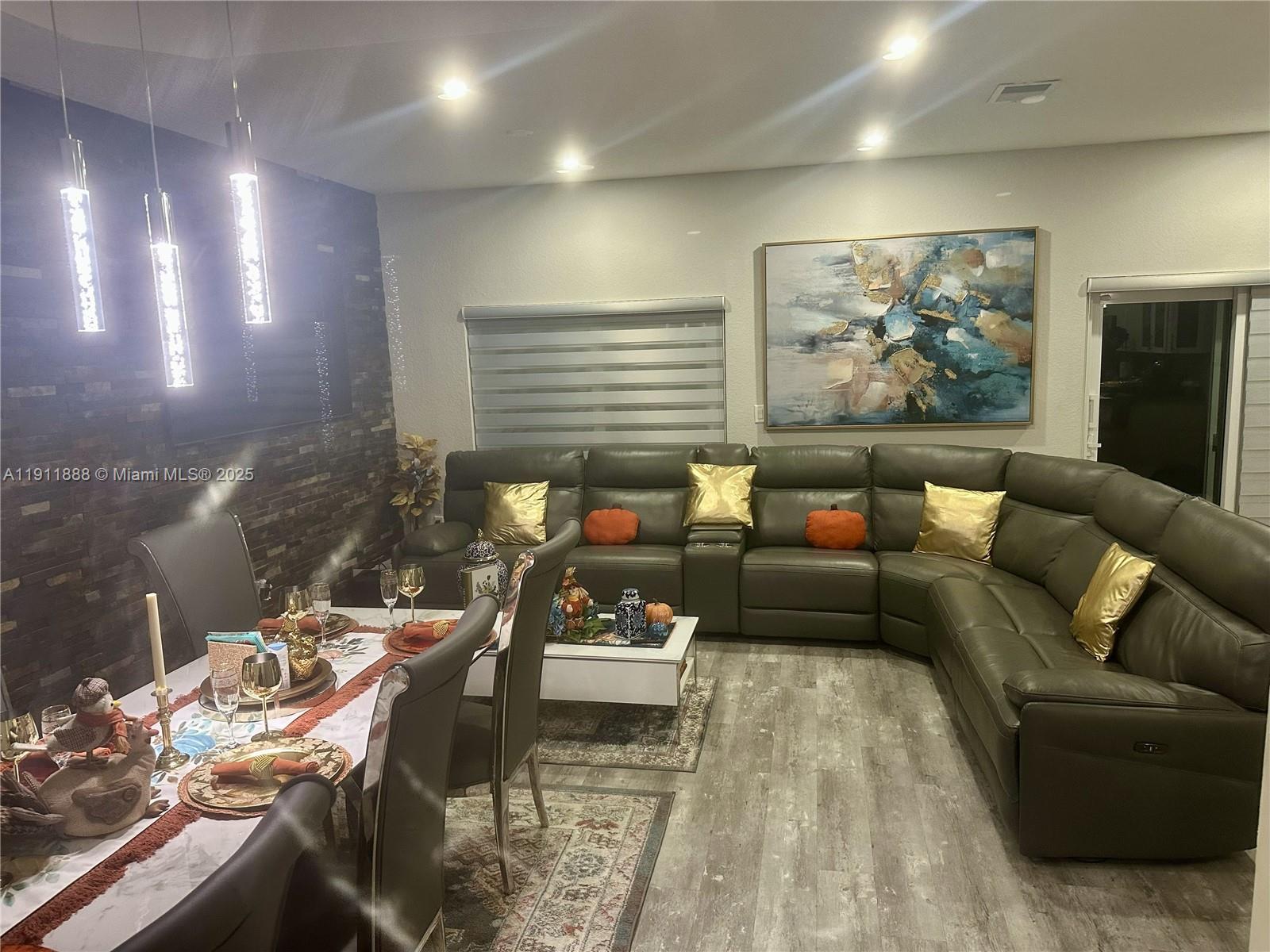 4972 Southwest 127th Avenue, Unit 4972 Miramar, FL 33027 - Photo 3 of 4 a living room with furniture and wooden floor