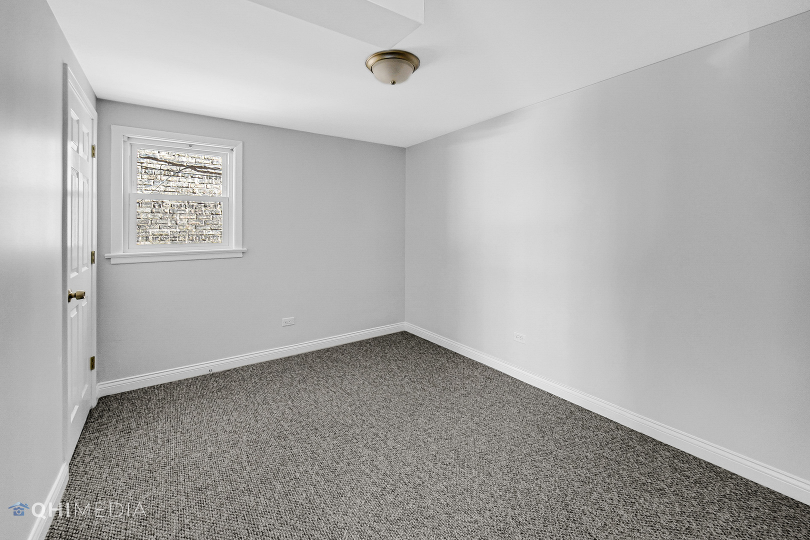 135 Custer Avenue, Unit 1 Evanston, IL 60202 - Photo 11 of 14 an empty room with a workbench