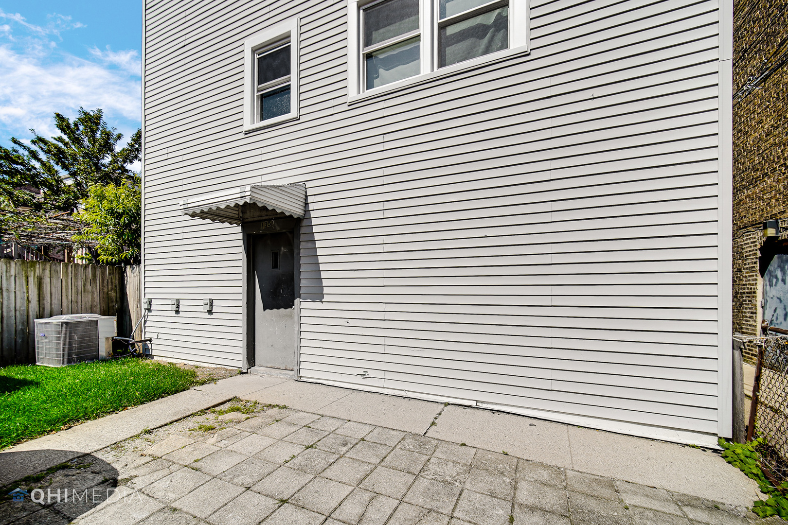 135 Custer Avenue, Unit 1 Evanston, IL 60202 - Photo 12 of 14 a view of a white house with a white door