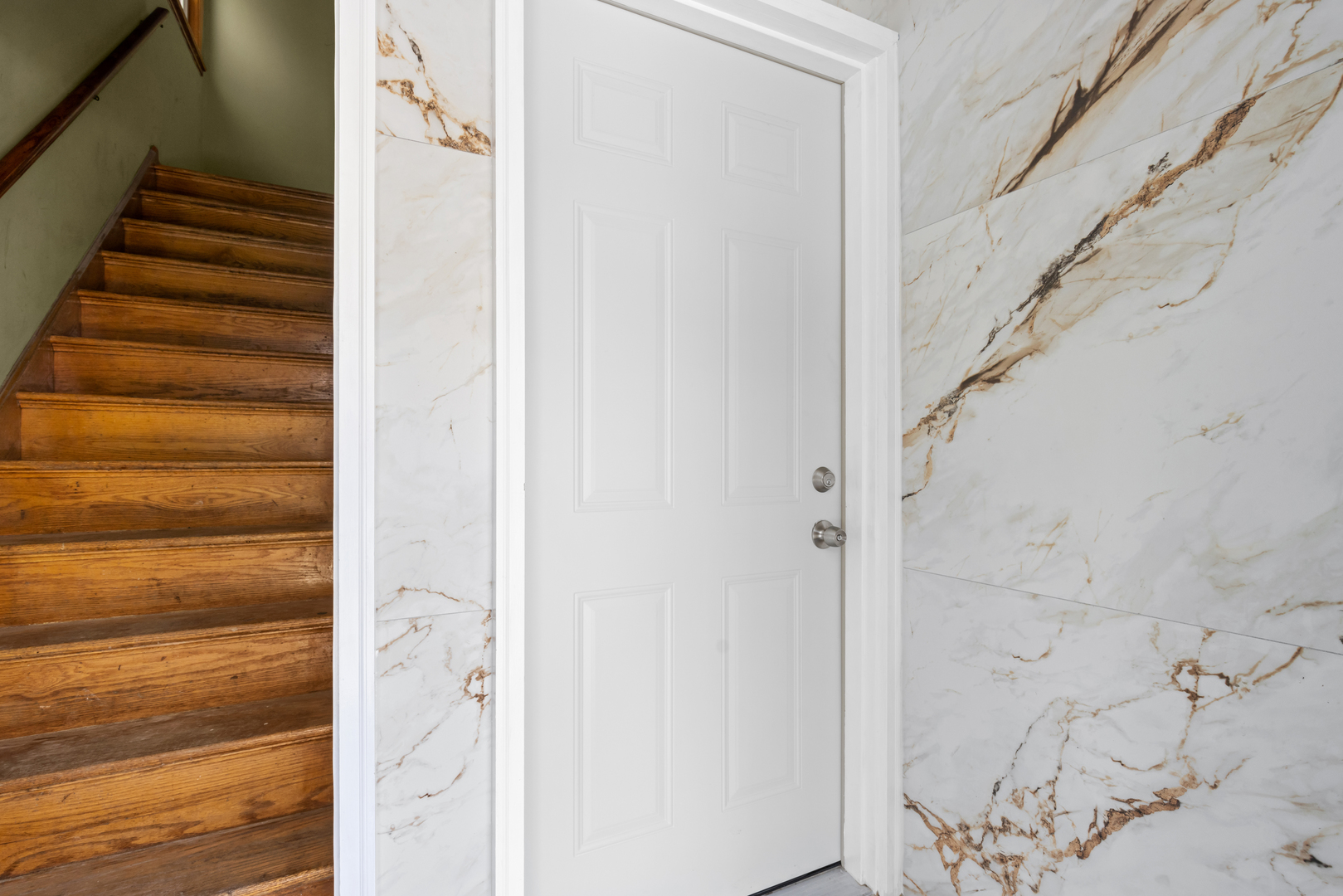 135 Custer Avenue, Unit 1 Evanston, IL 60202 - Photo 2 of 14 a view of staircase with white walls