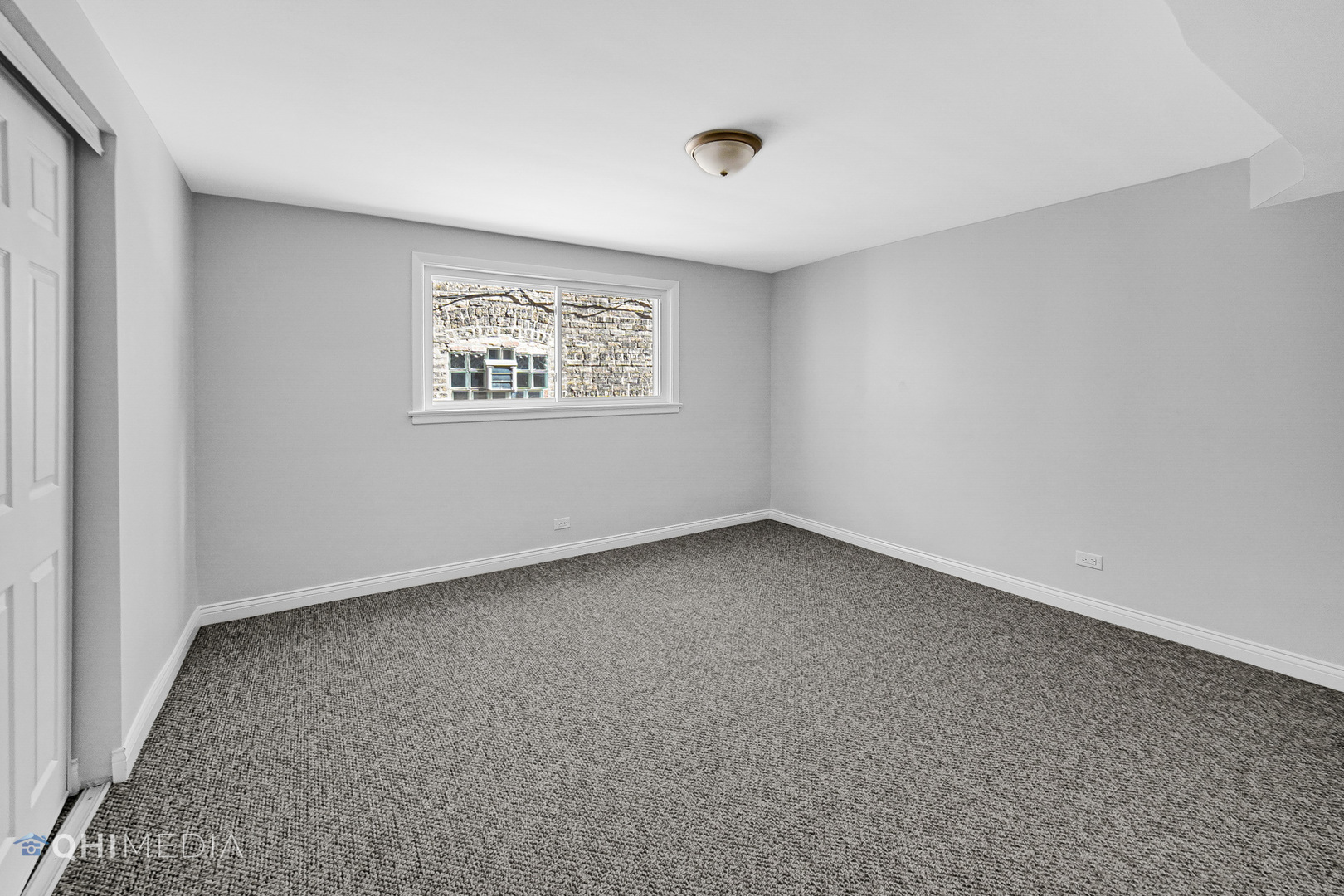 135 Custer Avenue, Unit 1 Evanston, IL 60202 - Photo 9 of 14 an empty room with a window