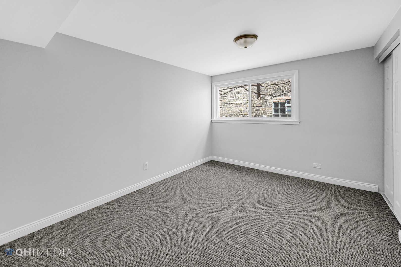 135 Custer Avenue, Unit 1 Evanston, IL 60202 - Photo 10 of 14 a view of an empty room with a window