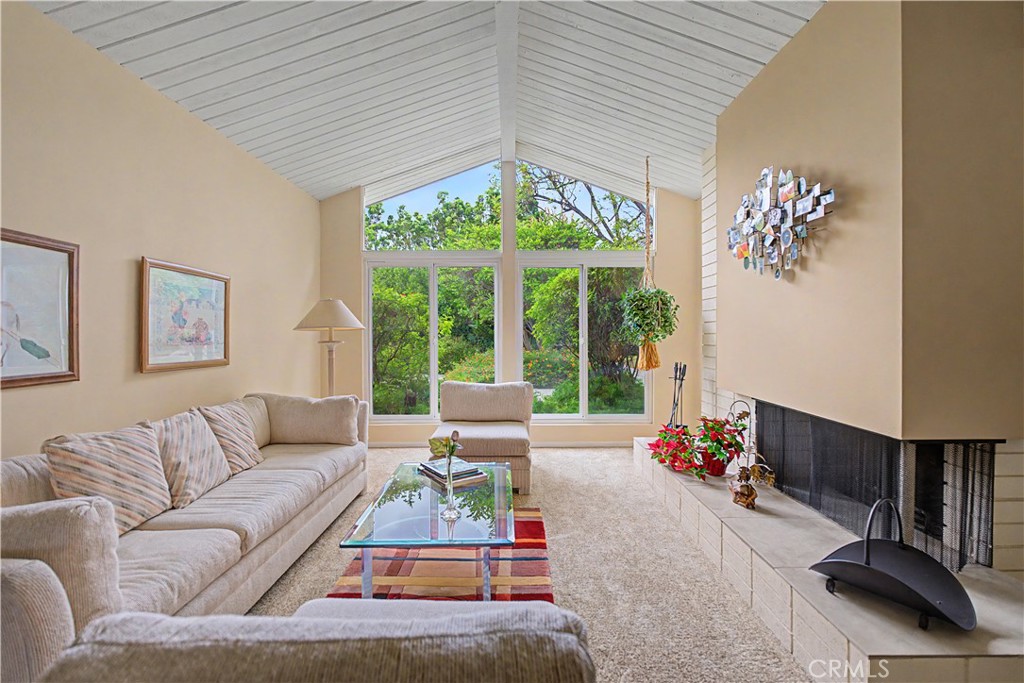 22671 Town Crier Road Calabasas, CA 91302 - Photo 24 of 35 a living room with furniture and a large window