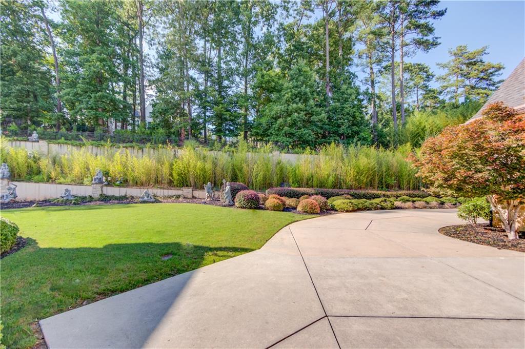 5004 Gunnison Trace Suwanee, GA 30024 - Photo 101 of 108 a view of a lake from a yard