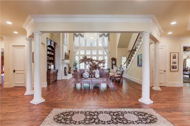 a view of a dining room with furniture and chandelier