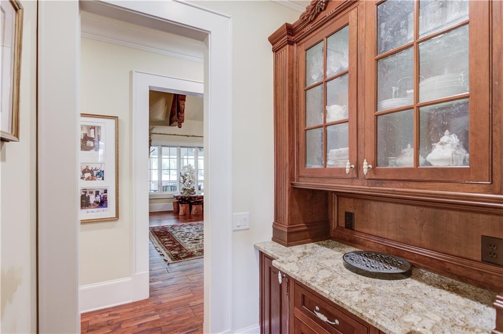5004 Gunnison Trace Suwanee, GA 30024 - Photo 23 of 108 a kitchen with granite countertop sink and cabinets