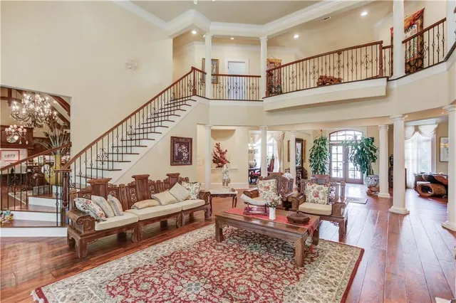 a bathroom with a granite countertop double vanity sink toilet and shower