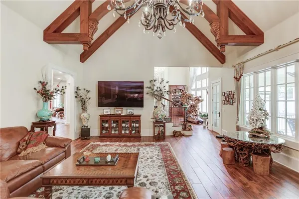 a view of a dining room with furniture and wooden floor