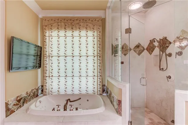 an aerial view of residential houses with outdoor space and pool