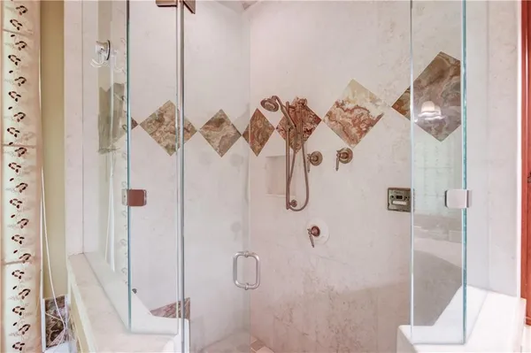 a view of a swimming pool with outdoor seating