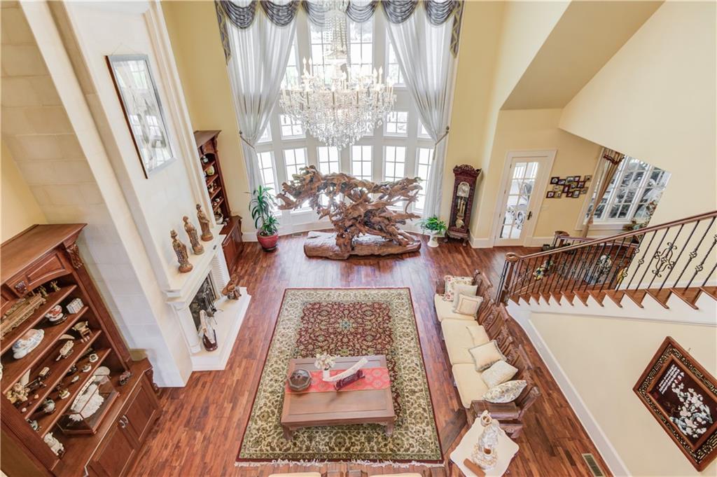 5004 Gunnison Trace Suwanee, GA 30024 - Photo 56 of 108 a living room with furniture and a rug