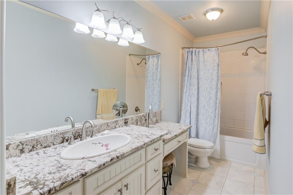 5004 Gunnison Trace Suwanee, GA 30024 - Photo 66 of 108 a bathroom with a granite countertop double vanity sink toilet and shower