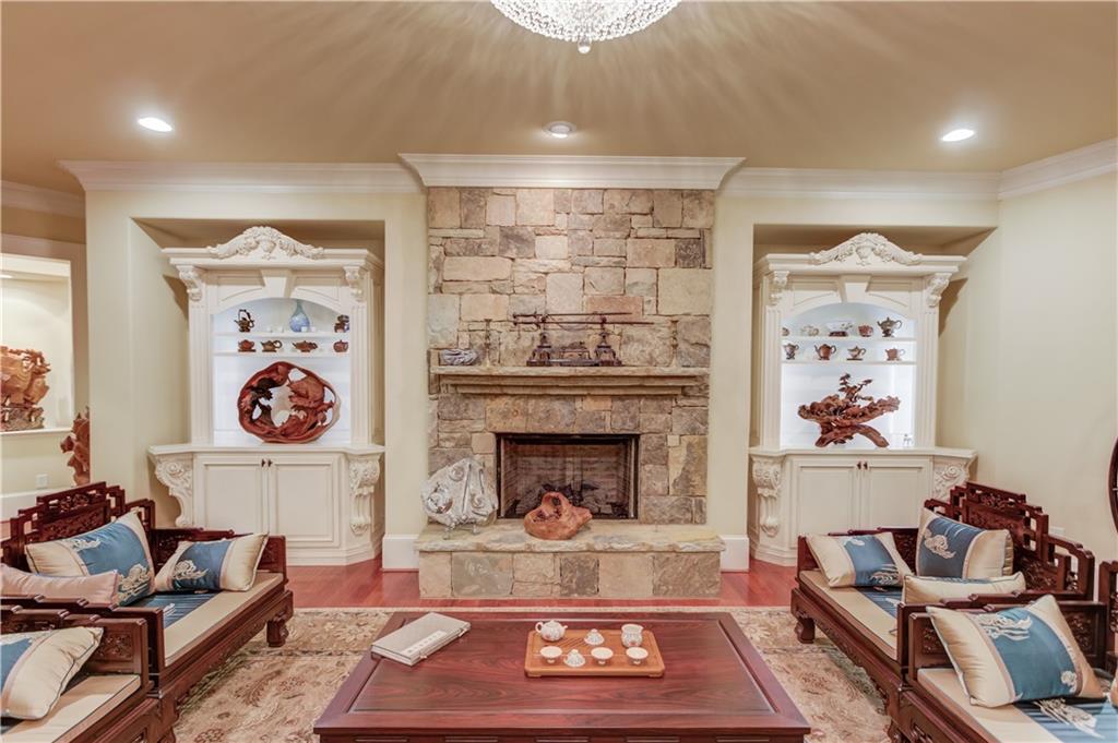 5004 Gunnison Trace Suwanee, GA 30024 - Photo 71 of 108 a living room with furniture and a fireplace