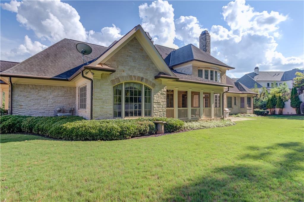 5004 Gunnison Trace Suwanee, GA 30024 - Photo 99 of 108 a front view of a house with a yard