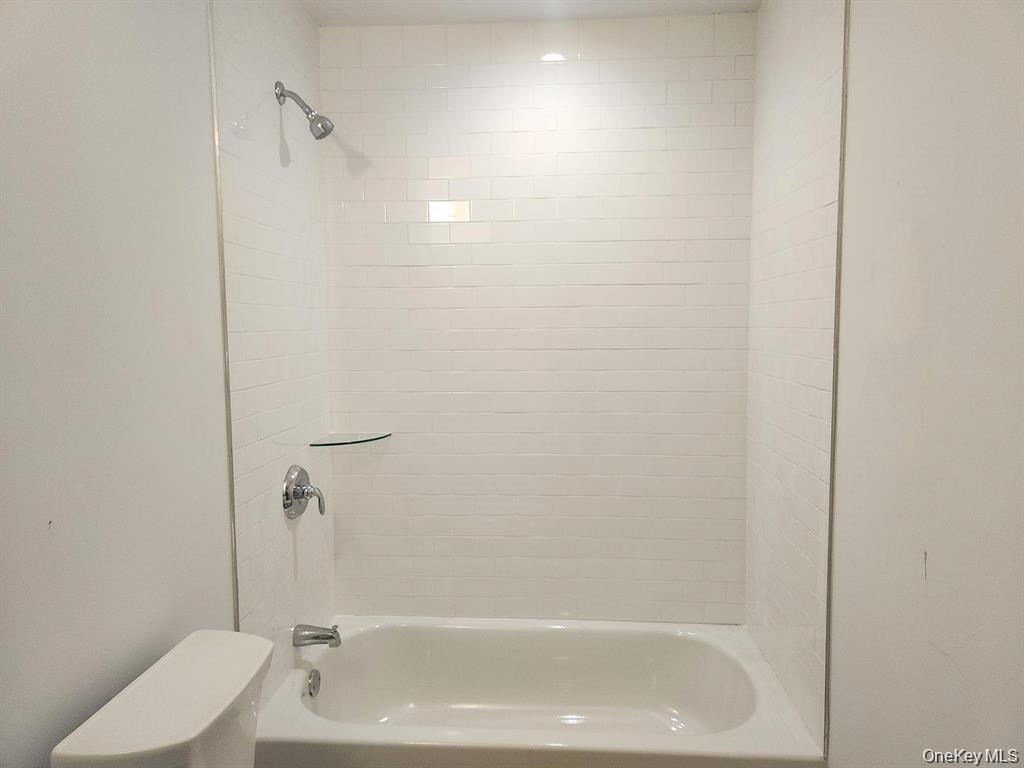 510 Neighborhood Road Shirley, NY 11967 - Photo 8 of 18 1st Floor full Bathroom with Subway tile
