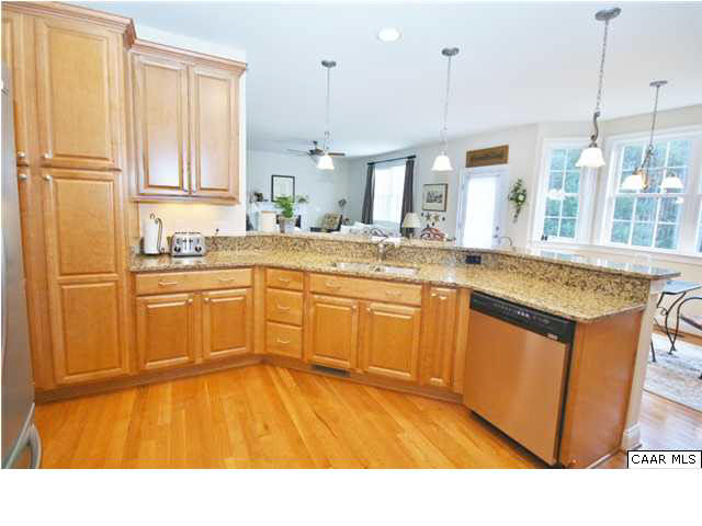 79 Ridgeview Drive Ruckersville, VA 22968 - Photo 10 of 29 a kitchen with stainless steel appliances granite countertop a sink and wooden cabinets