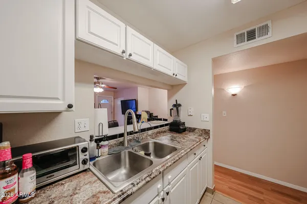 a kitchen with a sink and cabinets