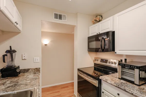 a kitchen with a stove and a microwave
