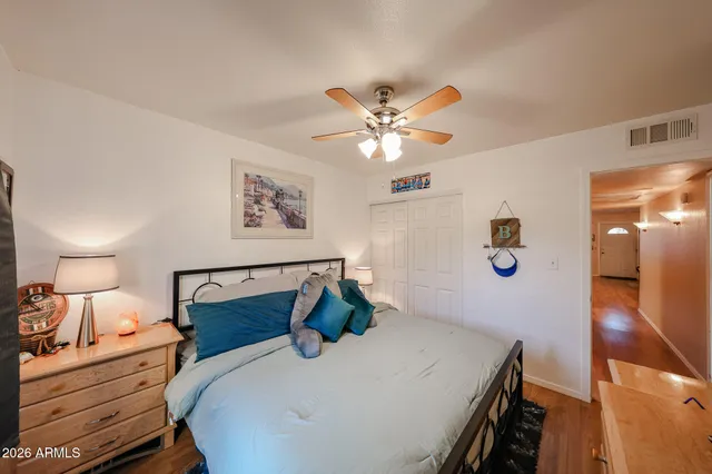 a bed room with furniture and a chandelier