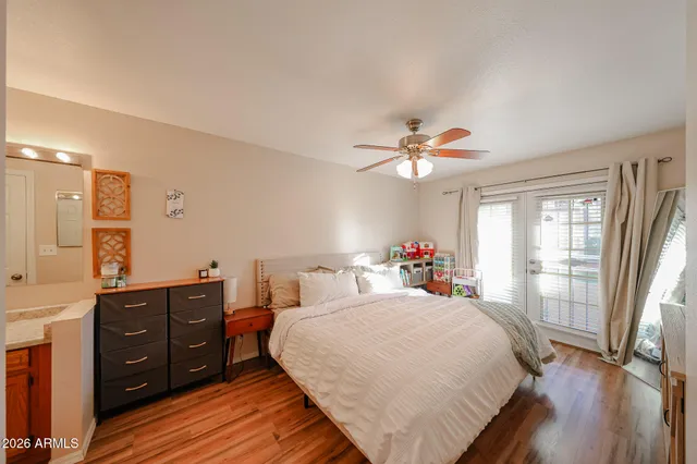 a bed room with a bed and a window