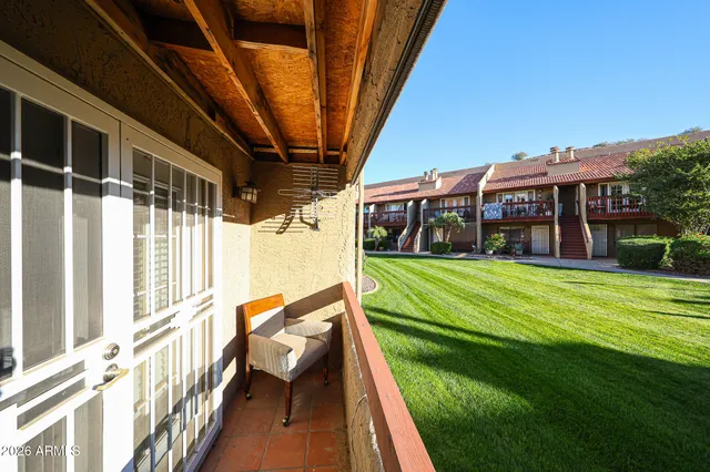 a view of house with a yard