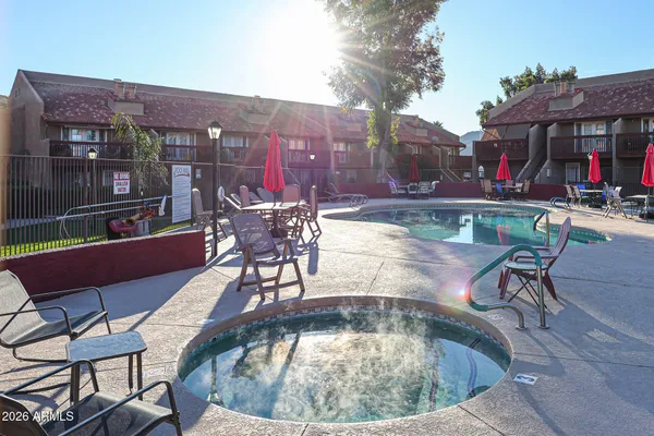 a view of a chairs and tables in the patio