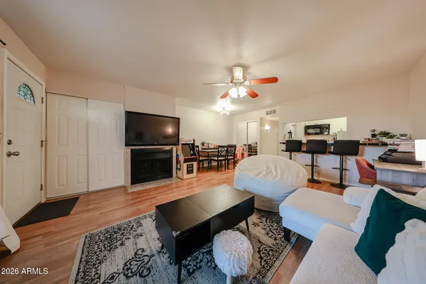 a living room with furniture and a flat screen tv