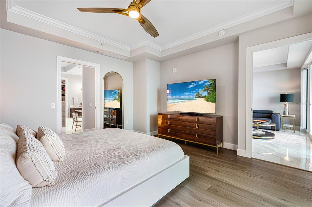 2745 First Street, Unit 1402 Fort Myers, FL 33916 - Photo 15 of 43 a bedroom with a bed and a chandelier