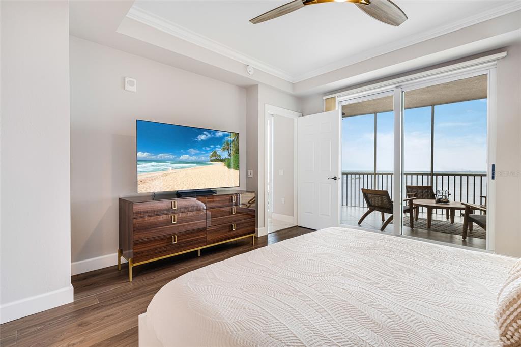 2745 First Street, Unit 1402 Fort Myers, FL 33916 - Photo 16 of 43 a bedroom with a bed and a table