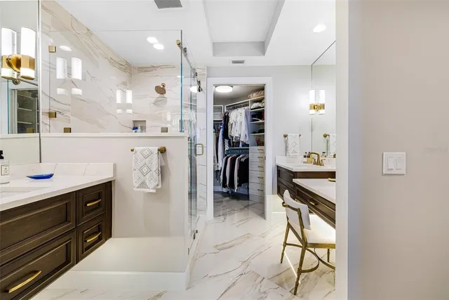 a kitchen with refrigerator and cabinets