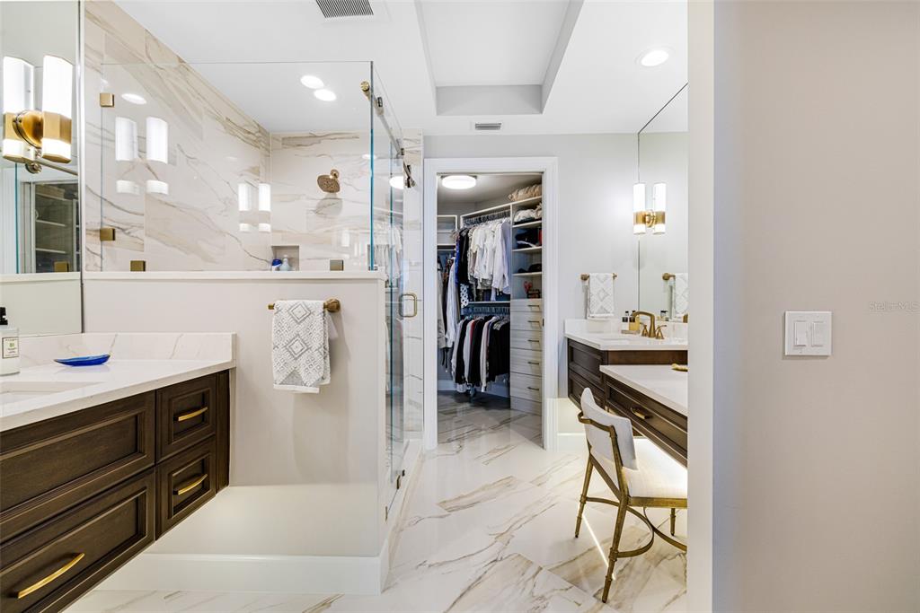 2745 First Street, Unit 1402 Fort Myers, FL 33916 - Photo 17 of 43 a kitchen with refrigerator and cabinets